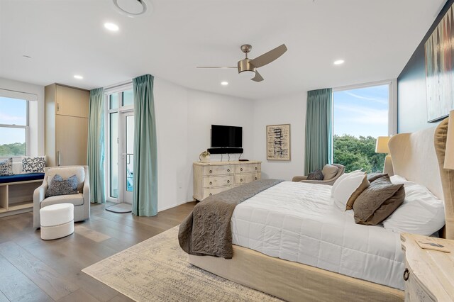 bedroom with light hardwood / wood-style flooring and ceiling fan