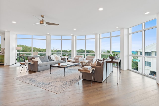 sunroom featuring ceiling fan