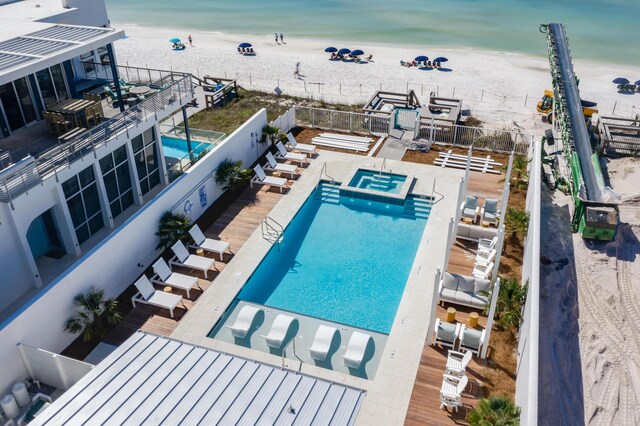 view of swimming pool with a water view