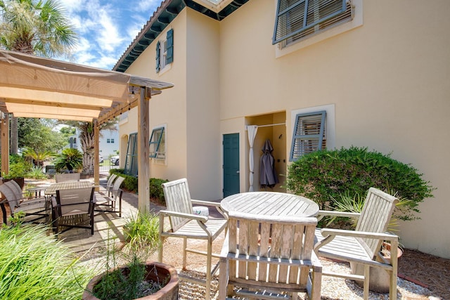 view of patio featuring a pergola