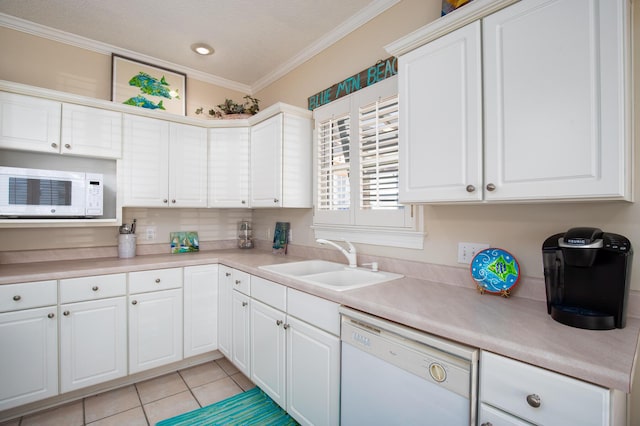 kitchen with white cabinetry, sink, white appliances, and ornamental molding