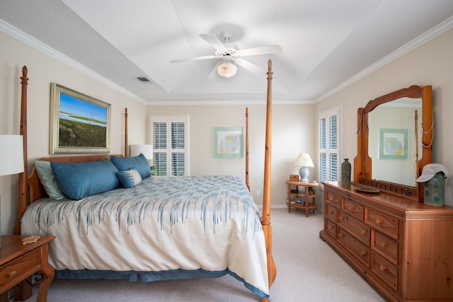 carpeted bedroom with ceiling fan, ornamental molding, and a textured ceiling