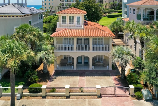 mediterranean / spanish home with a balcony