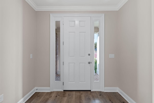 entrance foyer featuring crown molding and light hardwood / wood-style floors