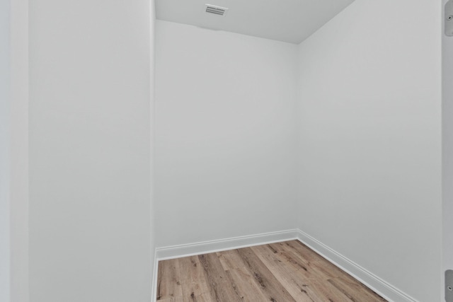 spare room featuring light hardwood / wood-style flooring