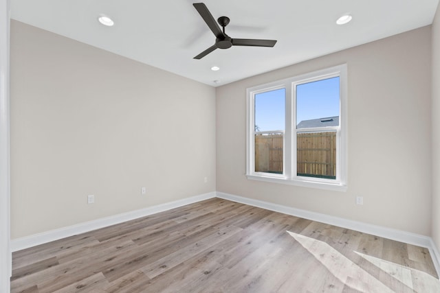 empty room with light hardwood / wood-style flooring and ceiling fan