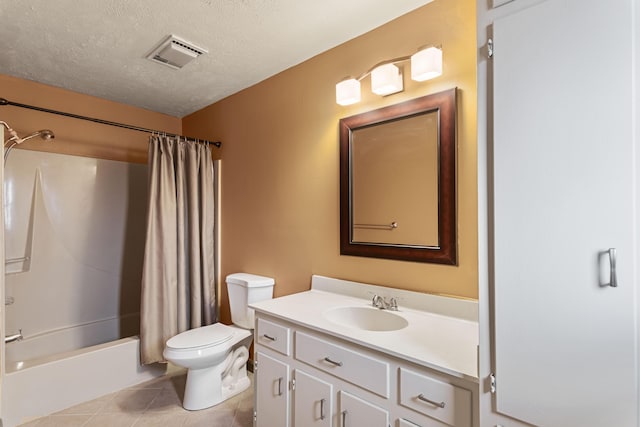 bathroom featuring visible vents, toilet, a textured ceiling, vanity, and tile patterned flooring