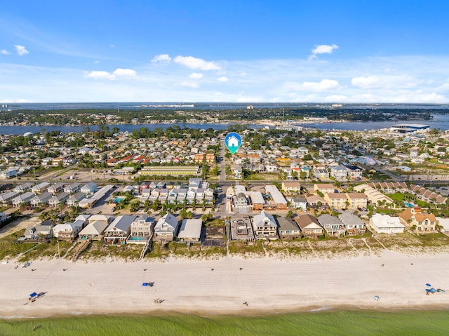 aerial view featuring a water view, a residential view, and a beach view