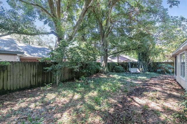 view of yard with a fenced backyard