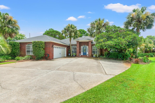 single story home with a front lawn and a garage