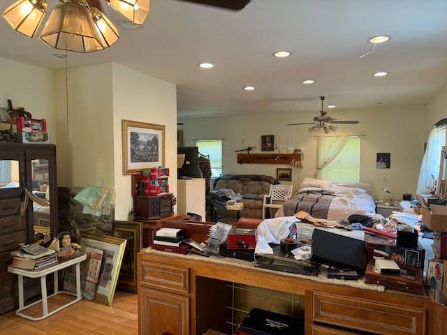 home office featuring light wood-type flooring and ceiling fan