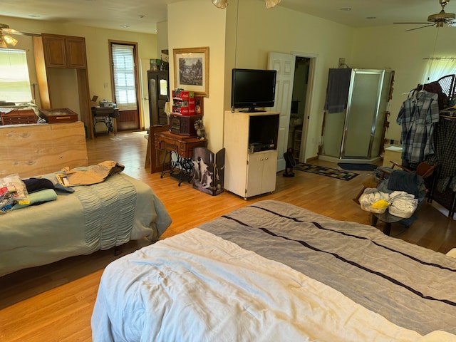 bedroom featuring ceiling fan and light hardwood / wood-style flooring