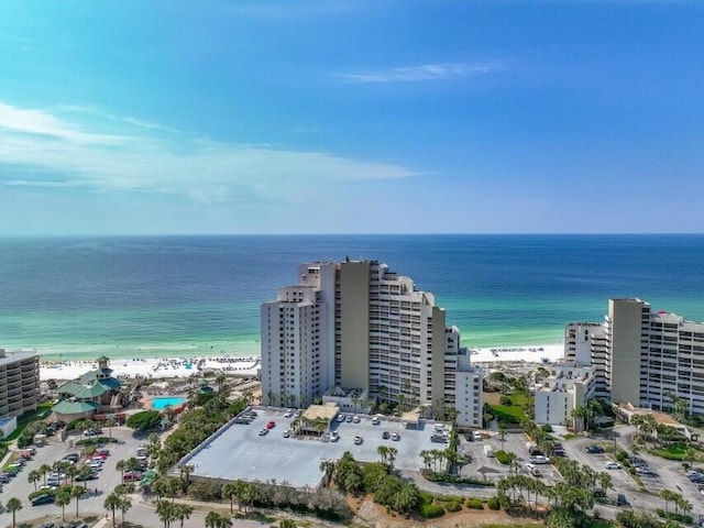 bird's eye view featuring a water view and a beach view