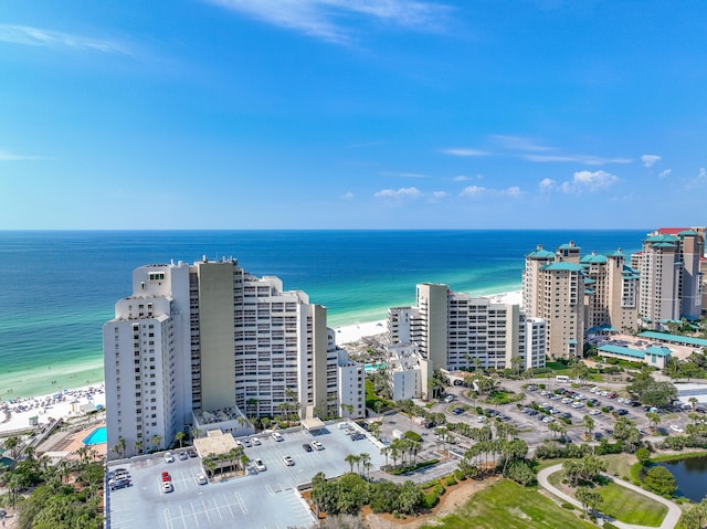 drone / aerial view featuring a water view and a beach view