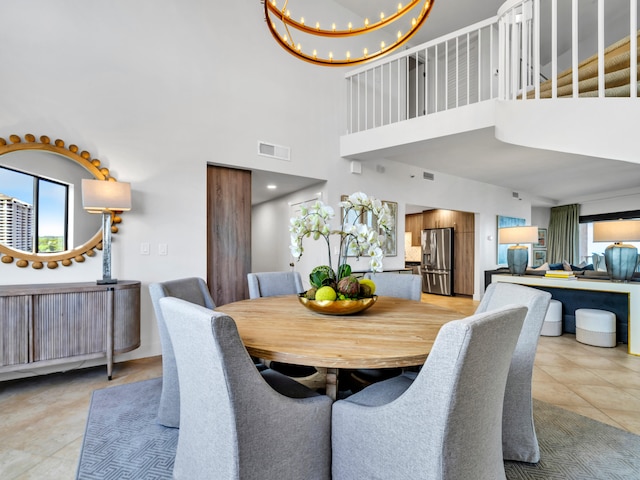 tiled dining space featuring a notable chandelier