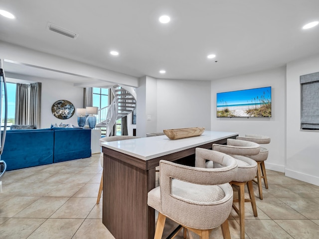 kitchen featuring light tile patterned flooring and a kitchen island