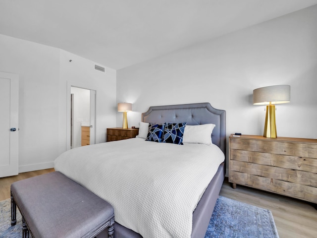 bedroom with light hardwood / wood-style floors