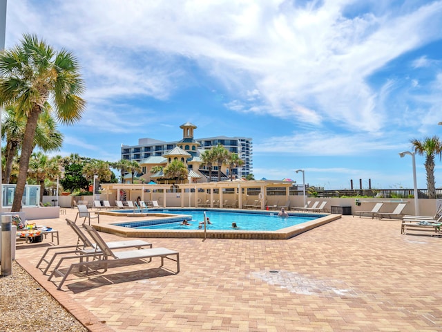 view of swimming pool featuring a patio