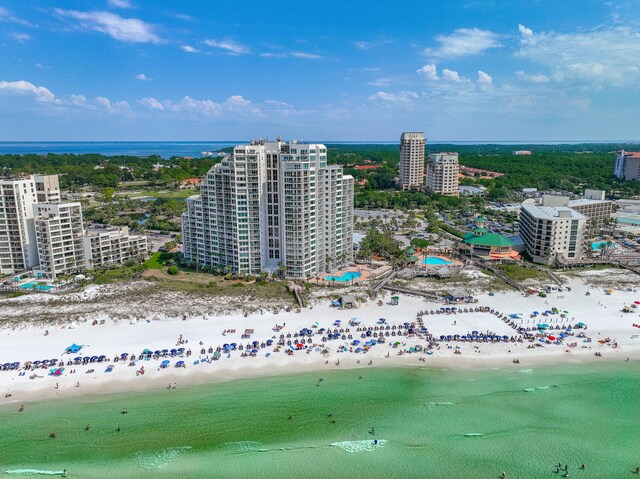 bird's eye view featuring a view of the beach and a water view