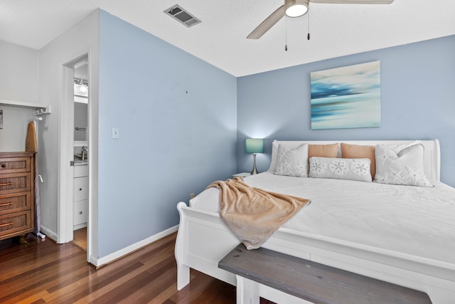 bedroom with ceiling fan and dark hardwood / wood-style flooring