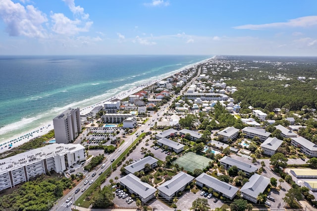 birds eye view of property featuring a water view and a beach view