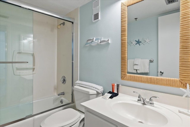 full bathroom featuring vanity, a textured ceiling, bath / shower combo with glass door, and toilet