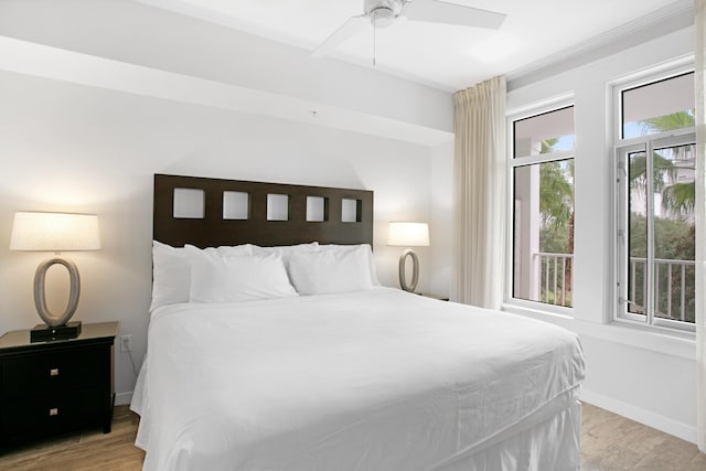 bedroom featuring light hardwood / wood-style floors and ceiling fan