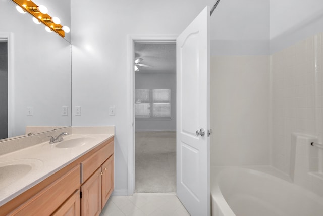 bathroom with vanity, tile patterned flooring, and a textured ceiling