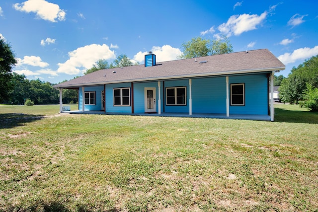 view of front of house featuring a patio area and a front yard