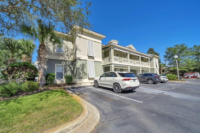 view of front of home with a balcony