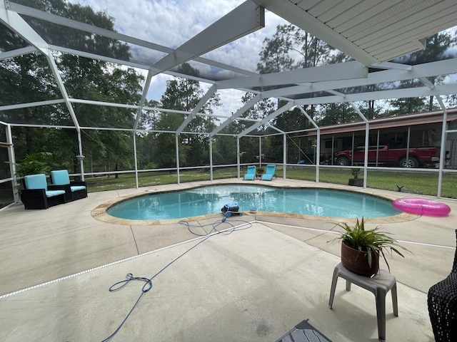 view of pool featuring a patio, a lanai, and a yard