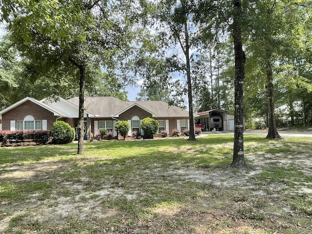 ranch-style house featuring a front yard