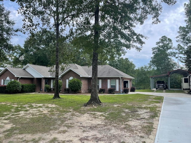 ranch-style house with a front yard and a carport