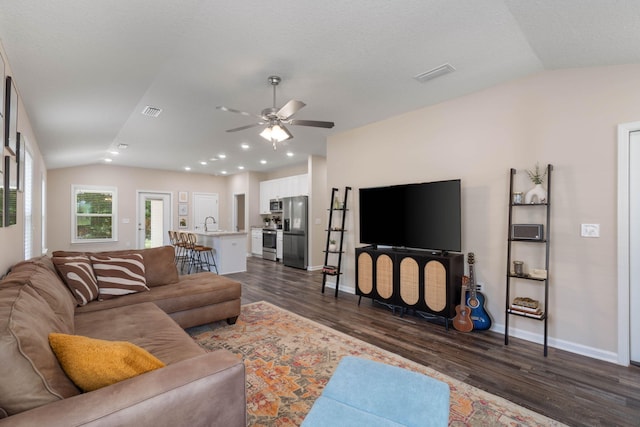 living room with sink, lofted ceiling, ceiling fan, and dark hardwood / wood-style floors