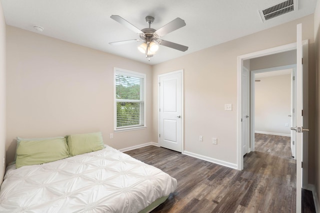 bedroom featuring dark hardwood / wood-style floors and ceiling fan