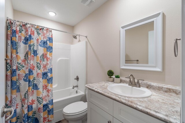 full bathroom with vanity, toilet, and shower / bath combination with curtain