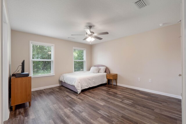 bedroom featuring dark hardwood / wood-style floors and ceiling fan