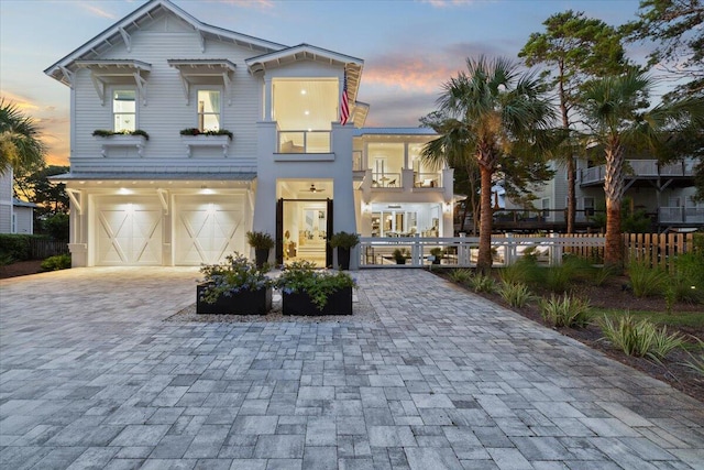 view of front facade featuring a balcony and a garage