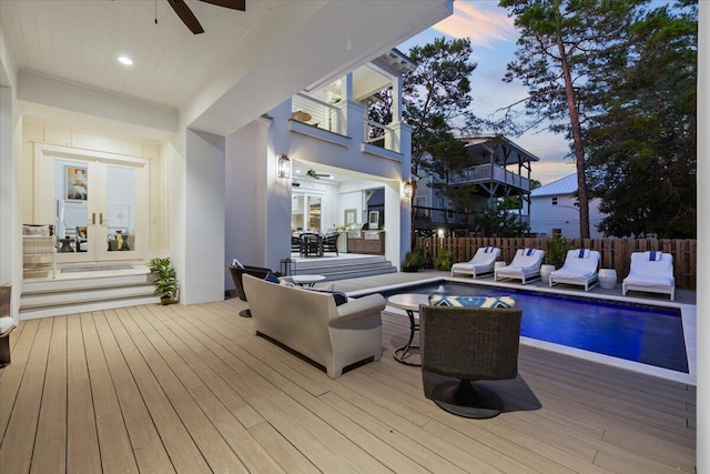 exterior space featuring ceiling fan, french doors, and a deck