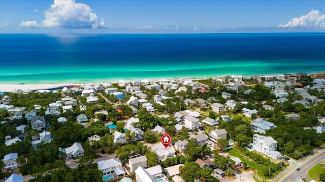 aerial view featuring a water view and a beach view