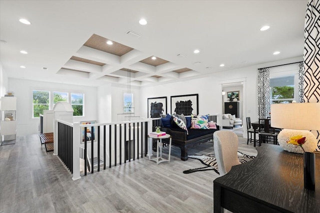 home office with beam ceiling, light wood-type flooring, and coffered ceiling