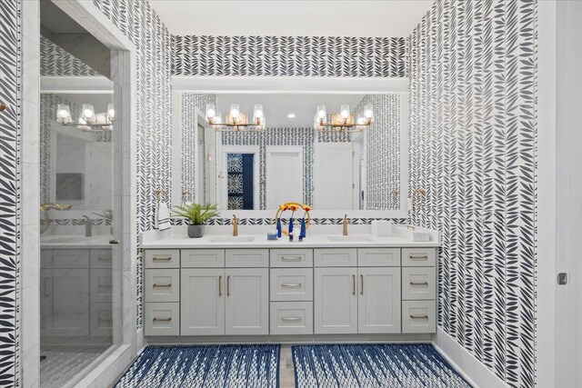 bathroom with vanity and a shower with shower door