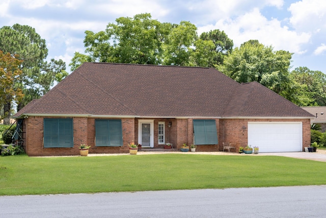 single story home featuring a garage and a front yard