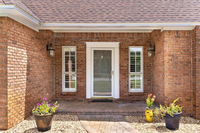 entrance to property with a patio