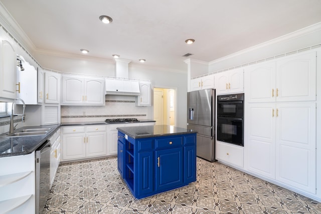 kitchen featuring blue cabinetry, sink, white cabinetry, a center island, and stainless steel appliances