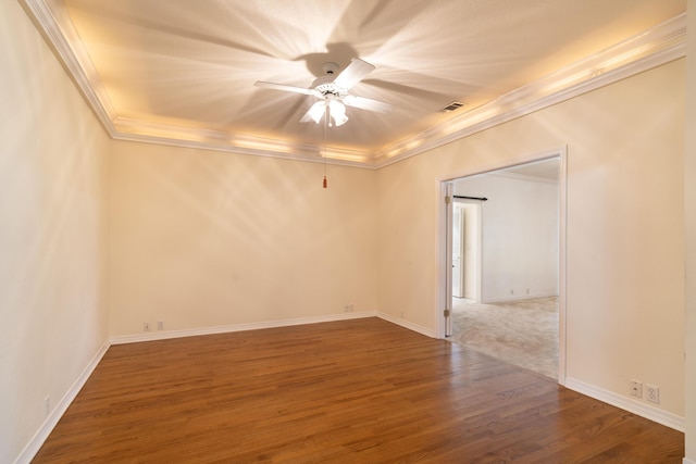 empty room with crown molding, ceiling fan, and wood-type flooring