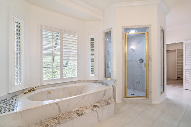 bathroom with crown molding and separate shower and tub