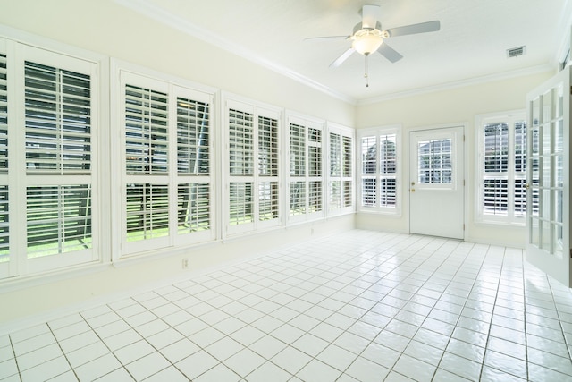 unfurnished sunroom with ceiling fan