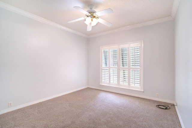 carpeted empty room featuring ornamental molding, a textured ceiling, and ceiling fan