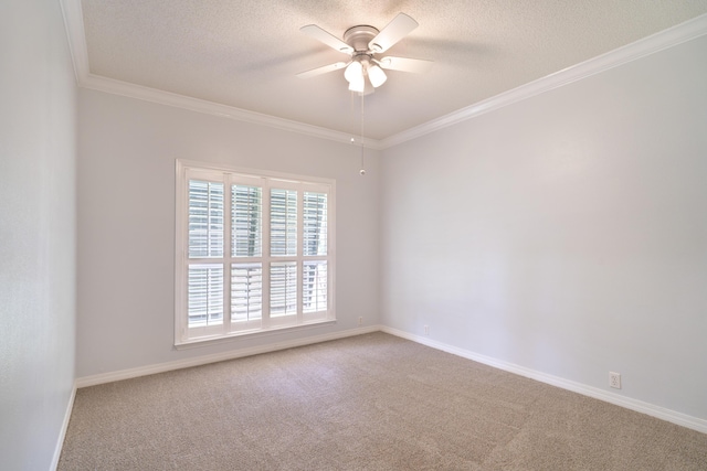 carpeted spare room featuring crown molding, a textured ceiling, and ceiling fan